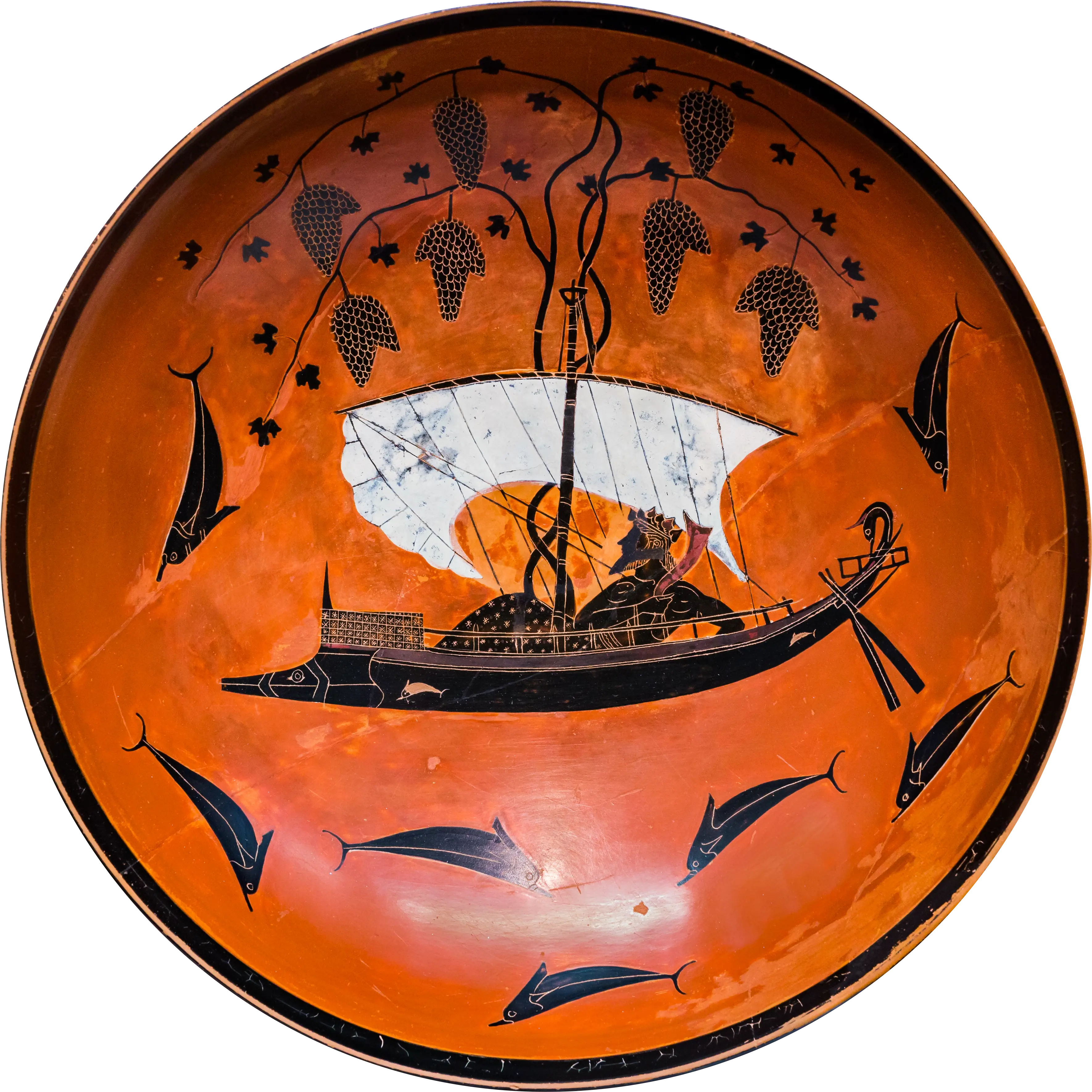 Ancient Greek black-figure kylix depicting the god Dionysos reclining in a sailing ship with grapevines around the mast and dolphins swimming around the vessel