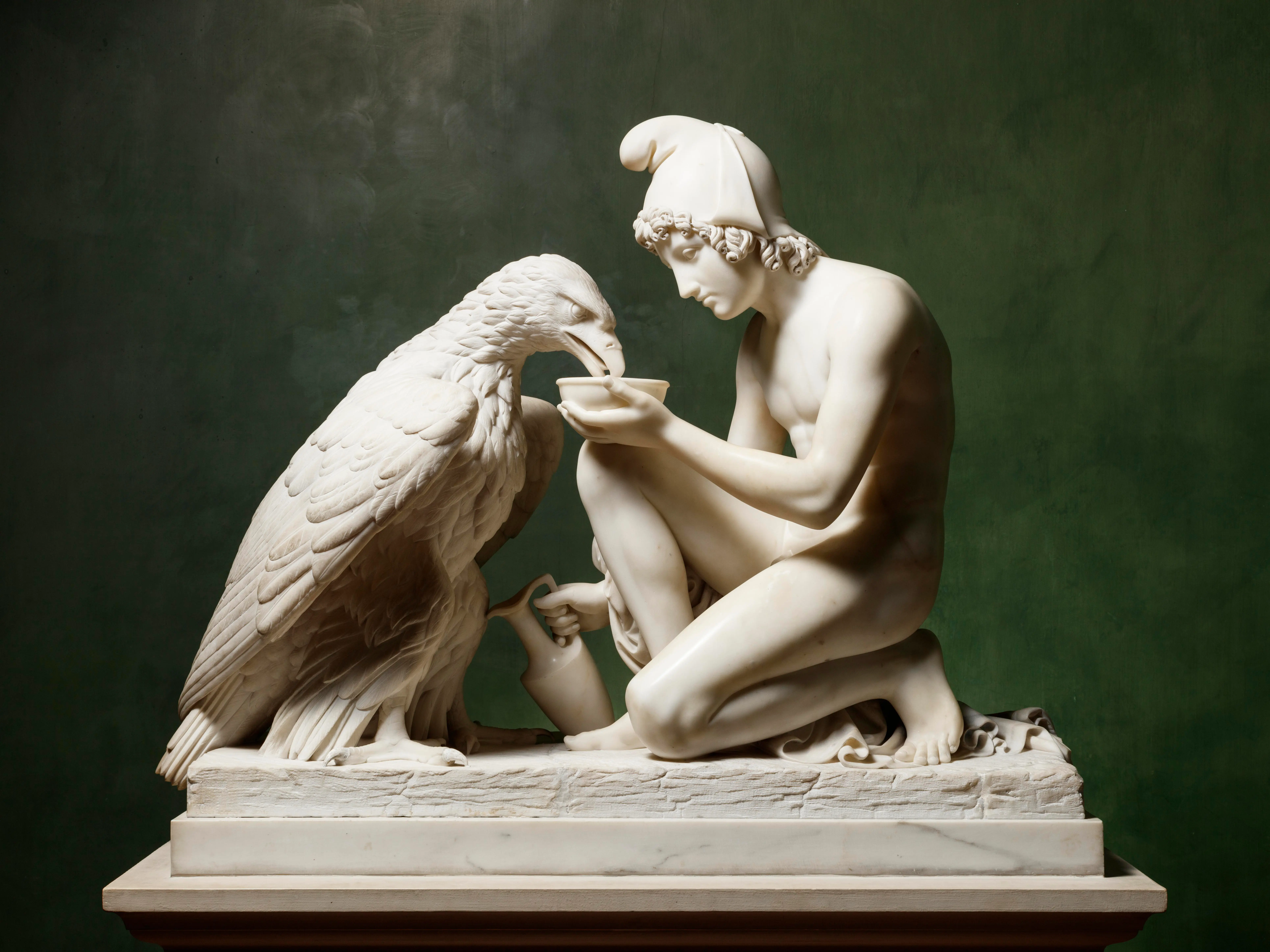 Thorvaldsen's marble sculpture Ganymede with Jupiter's Eagle, showing the kneeling youth offering a cup to the eagle